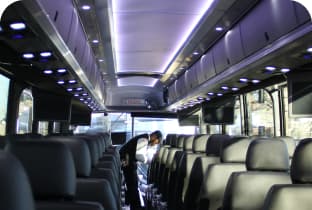 Interior of a luxury charter bus with leather seating
