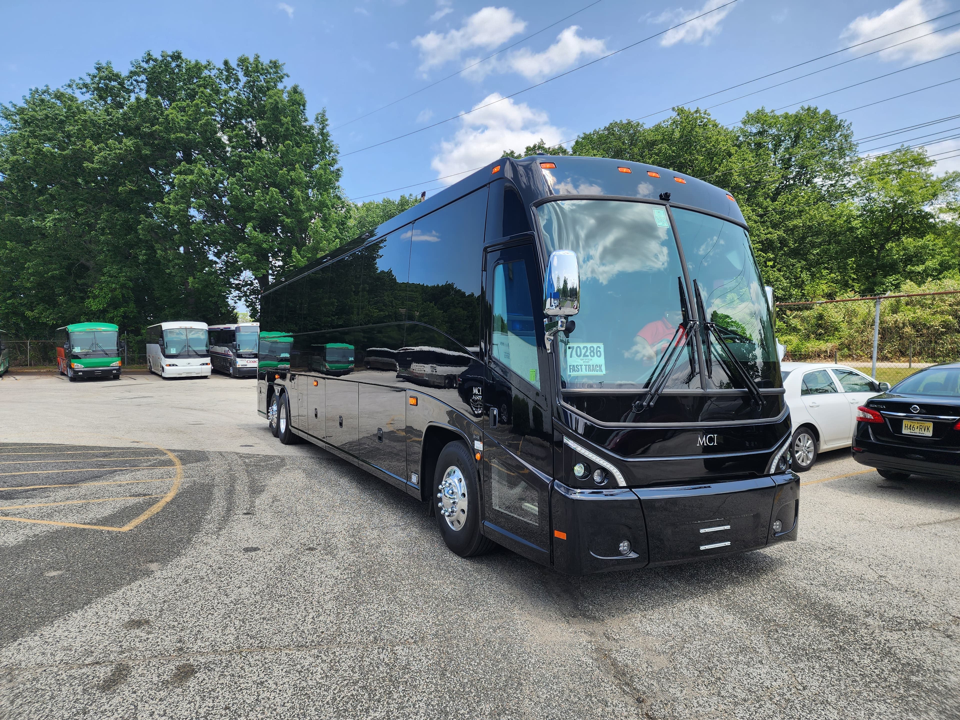 MCI J4500 luxury motorcoach parked outdoors