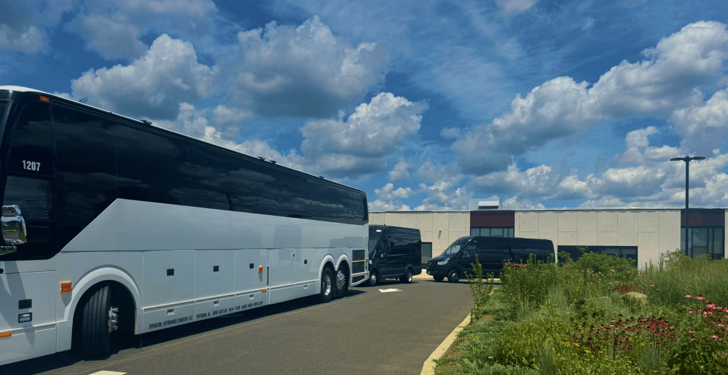 Charter bus traveling through city skyline